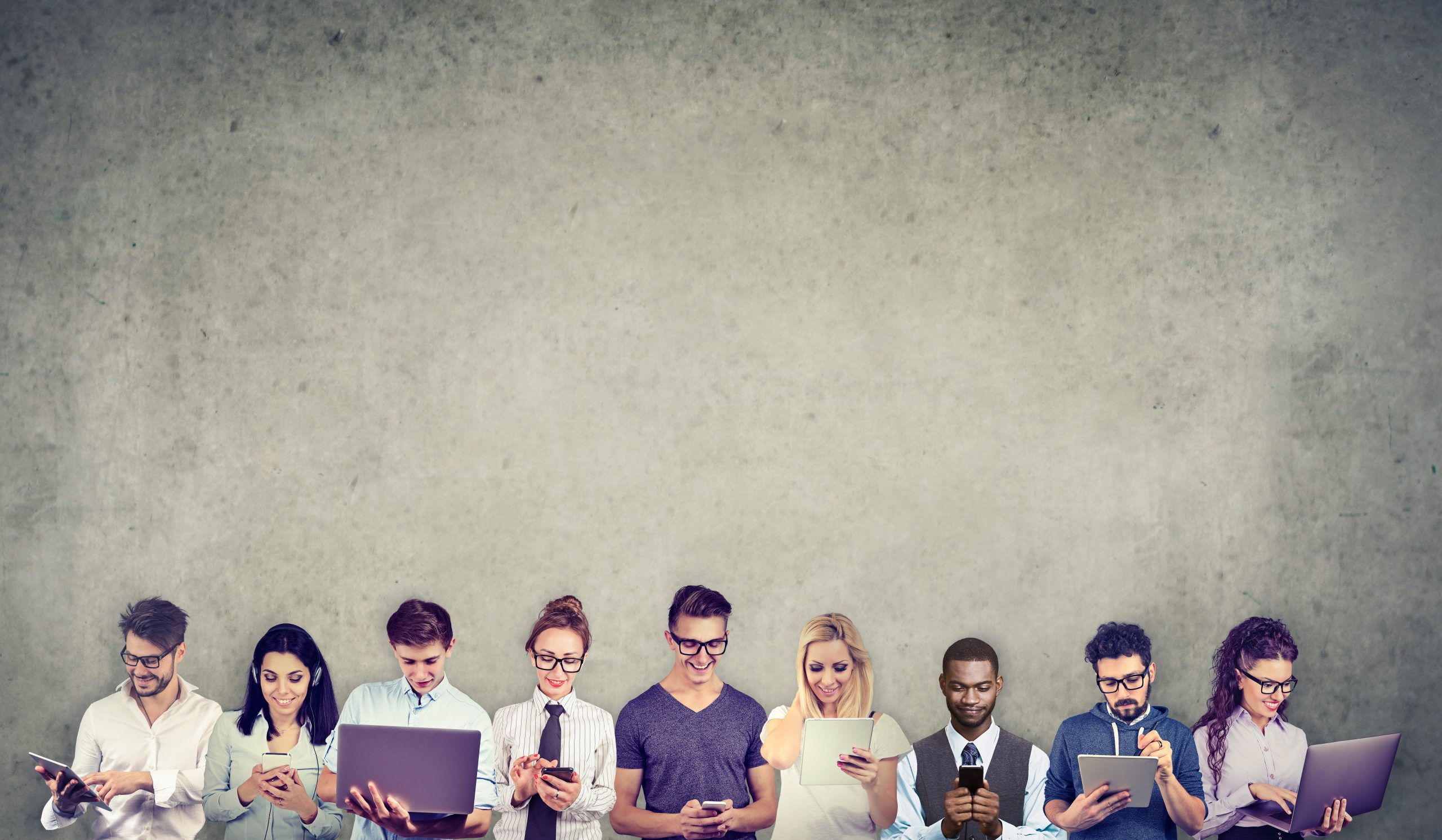 Group of multicultural people connected by using digital mobile gadgets